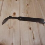 Menší nerezový rozpěrák s hákem